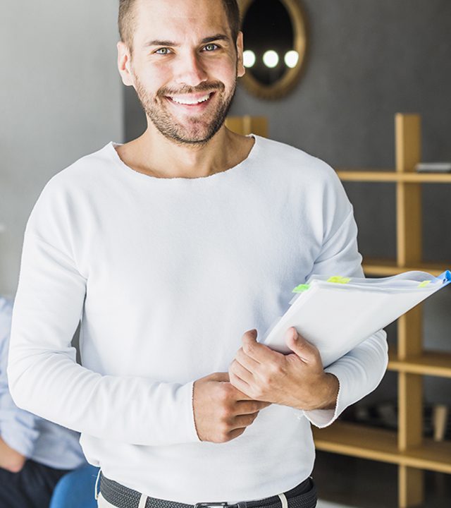 portrait-smiling-young-businessman-holding-folder portrait-smiling-young-businessman-holding-folder