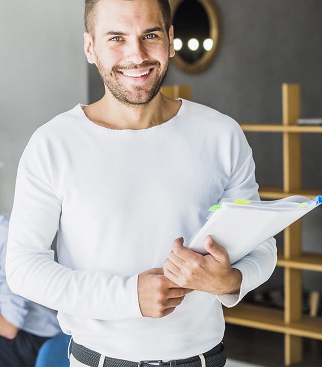 portrait-smiling-young-businessman-holding-folder portrait-smiling-young-businessman-holding-folder